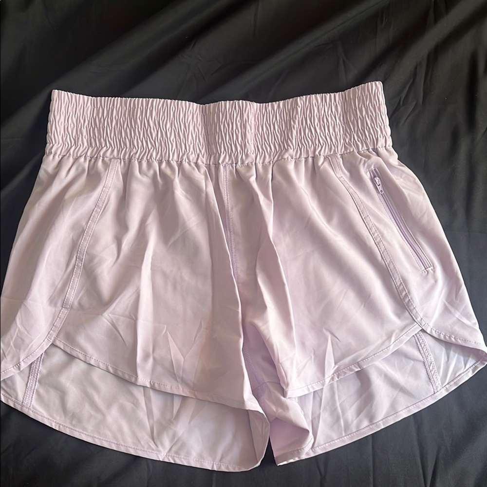 Purple Athletic Shorts with Elastic Waistband and Curved Hems